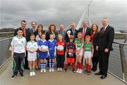 1 March 2012; Children from clubs in the area who will take part in the Feile in Derry City as part of the GAA Participation in City of Culture Derry 2013 are joined by, back row, from left to right, Patsy Mullan, Chairman of Derry 2013 events committee, Michael McGoldrick, Chairman National Feile Og, Martina Anderson, MLA , Junor Minister Northern Ireland Executive,Caral Ni Chulin, MLA, Minster Culture, Arts and Leisure, Northern Ireland Executive, Pat Quill, President of the Ladies Gaelic Football Association, Uachtarán Chumann Lúthchleas Gael Criostóir Ó Cuana, John Keenan, Chairman of Derry GAA, Shona McCarthy, Chief Executive Culture Company 2013, Martin McAviney, Vice President Ulster GAA, on the Peace Bridge in Derry City before the launch of GAA Participation in City of Culture Derry 2013. Peace Bridge, Derry. Picture credit: Oliver McVeigh / SPORTSFILE