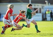 3 March 2012; Lynne Cantwell, Ireland, is tackled by Jamie Kift, left, and Adi Taviner, Wales. Women's Six Nations Rugby Championship, Refixture, Ireland v Wales, Ashbourne RFC, Ashbourne, Co. Meath. Picture credit: Matt Browne / SPORTSFILE