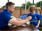 5 July 2017; Jamie Heaslip and Jamison Gibson-Park of Leinster Rugby came out to the Bank of Ireland Summer Camp to meet up with some local young rugby talent in Terenure College RFC. Pictured is Leinster's Jamie Heaslip signing the shirt of Will Loughlin, age 6, from Rathgar, Dublin. Terenure College RFC, Terenure, Dublin. Photo by Seb Daly/Sportsfile