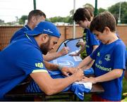 5 July 2017; Jamie Heaslip and Jamison Gibson-Park of Leinster Rugby came out to the Bank of Ireland Summer Camp to meet up with some local young rugby talent in Terenure College RFC. Pictured is Leinster's Jamison Gibson-Park signing a shirt for Milo Malone, from Inchicore, Dublin. Terenure College RFC, Terenure, Dublin. Photo by Seb Daly/Sportsfile