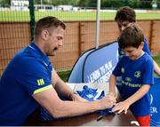 5 July 2017; Jamie Heaslip and Jamison Gibson-Park of Leinster Rugby came out to the Bank of Ireland Summer Camp to meet up with some local young rugby talent in Terenure College RFC. Pictured is Leinster's Jamie Heaslip signing the shirt of Milo Malone, from Inchicore, Dublin. Terenure College RFC, Terenure, Dublin. Photo by Seb Daly/Sportsfile