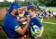5 July 2017; Jamie Heaslip and Jamison Gibson-Park of Leinster Rugby came out to the Bank of Ireland Summer Camp to meet up with some local young rugby talent in Terenure College RFC. Pictured is Leinster's Jamison Gibson-Park signing the shirt of young Max Morton, from Terenure, Dublin. Terenure College RFC, Terenure, Dublin. Photo by Seb Daly/Sportsfile