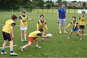 5 July 2017; Jamie Heaslip and Jamison Gibson-Park of Leinster Rugby came out to the Bank of Ireland Summer Camp to meet up with some local young rugby talent in Terenure College RFC. Pictured is Leinster's Jamie Heaslip during a coaching exercise with the players. Terenure College RFC, Terenure, Dublin. Photo by Seb Daly/Sportsfile
