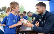 5 July 2017; Rob Kearney and Ross Byrne of Leinster Rugby came out to the Bank of Ireland Leinster Rugby Summer Camp at Donnybrook Stadium. Pictured is Nathan Keogh, age 7, getting an autograph from Ross Byrne at Donnybrook Stadium in Dublin. Photo by Cody Glenn/Sportsfile