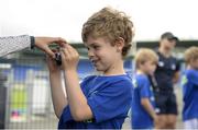 5 July 2017; Rob Kearney and Ross Byrne of Leinster Rugby came out to the Bank of Ireland Leinster Rugby Summer Camp at Donnybrook Stadium. Pictured is a young camper taking pictures at Donnybrook Stadium in Dublin. Photo by Cody Glenn/Sportsfile