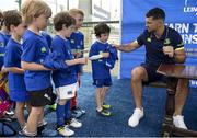 5 July 2017; Rob Kearney and Ross Byrne of Leinster Rugby came out to the Bank of Ireland Leinster Rugby Summer Camp at Donnybrook Stadium. Pictured is Felix Langan, age 6, being the first to have his jersey signed by Rob Kearney at Donnybrook Stadium in Dublin. Photo by Cody Glenn/Sportsfile