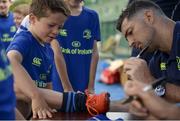 5 July 2017; Rob Kearney and Ross Byrne of Leinster Rugby came out to the Bank of Ireland Leinster Rugby Summer Camp at Donnybrook Stadium. Pictured is Jack Clarke, age 8, getting an autograph on his boots from Rob Kearney at Donnybrook Stadium in Dublin. Photo by Cody Glenn/Sportsfile