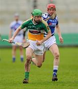 26 February 2012; Derek Morkan, Offaly, in action against Joe Fitzpatrick, Laois. Allianz Hurling League, Division 1B, Round 1, Offaly v Laois, O'Connor Park, Tullamore, Co. Offaly. Picture credit: Brian Lawless / SPORTSFILE