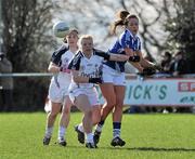 4 March 2012; Anna Moore, Laois, in action against Donna Berry, centre, and Kiri Lowry, left, Kildare. Bord Gais Energy Ladies National Football League, Division 1, Round 4, Kildare v Laois, Ballykelly, Co. Kildare. Picture credit: Barry Cregg / SPORTSFILE
