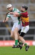 11 February 2012; Sylvie Óg Linnane, Gort, in action against Kevin Brady, Coolderry. AIB GAA Hurling All-Ireland Senior Club Championship Semi-Final, Coolderry, Offaly, v Gort, Galway, Gaelic Grounds, Limerick. Picture credit: Stephen McCarthy / SPORTSFILE