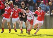 4 March 2012; Damian McCaul, Tyrone, in action against Ray Finnegan and Paddy Keenan, right, Louth. Allianz Football League, Division 2, Round 3, Louth v Tyrone, County Grounds, Drogheda, Co. Louth. Photo by Sportsfile