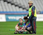 4 March 2012; Drom/Inch manager Johnny Harkin consoles Rosie Kenneally and Deirdre Dunne, left, after the match. All Ireland Senior Camogie Club Championship Final 2011, Drom/Inch, Tipperary v Oulart-the-Ballagh, Wexford, Croke Park, Dublin. Picture credit: Brian Lawless / SPORTSFILE