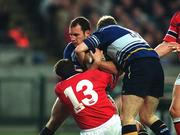 15 December 2001; Girvan Dempsey, Leinster, supported by team-mate Gordon D'Arcy (11), is tackled by Munster's Rob Henderson. Leinster v Munster, Celtic League, Final, Lansdowne Road, Dublin. Rugby. Picture credit; Brendan Moran / SPORTSFILE