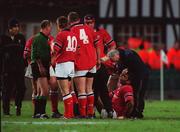 15 December 2001; Munster's Jim Williams is attended to by the team doctor. Leinster v Munster, Celtic League Final, Lansdowne, Dublin. Rugby. Picture credit; Brendan Moran / SPORTSFILE