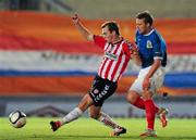 5 March 2012; Simon Madden, Derry City, in action against Peter Thompson, Linfield. 2012 Setanta Sports Cup, Quarter-Final, 1st Leg, Linfield v Derry City, Windsor Park, Belfast, Co. Antrim. Picture credit: Oliver McVeigh / SPORTSFILE