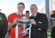 3 March 2012; UCC captain Shane Bourke is presented with the Fitzgibbon cup by Uachtaran Chumann Lúthchleas Gael Criostóir Ó Cuana after victory over CIT. Irish Daily Mail Fitzgibbon Cup Final, University College Cork v Cork Institute of Technology, Mardyke Arena, Cork. Picture credit: Diarmuid Greene / SPORTSFILE