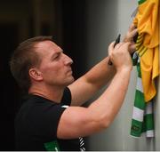 8 July 2017; Glasgow Celtic manager Brendan Rodgers signs shirts ahead of the friendly match between Shamrock Rovers and Glasgow Celtic at Tallaght Stadium in Dublin. Photo by David Fitzgerald/Sportsfile