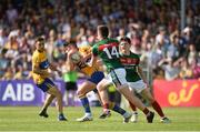 8 July 2017; Cian O'Dea of Clare in action against Cillian O'Connor, left, and Conor Loftus of Mayo during the GAA Football All-Ireland Senior Championship Round 3A match between Clare and Mayo at Cusack Park in Ennis, Co Clare. Photo by Diarmuid Greene/Sportsfile