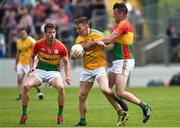 8 July 2017; Ronan Kennedy of Leitrim in action against Paul Broderick, left, and Eoghan Ruth, right, of Carlow during the GAA Football All-Ireland Senior Championship Round 2B match between Carlow and Leitrim at Netwatch Cullen Park in Co Carlow. Photo by Barry Cregg/Sportsfile
