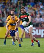 8 July 2017; Aidan O'Shea of Mayo in action against Eoghan Collins of Clare during the GAA Football All-Ireland Senior Championship Round 3A match between Clare and Mayo at Cusack Park in Ennis, Co Clare. Photo by Diarmuid Greene/Sportsfile