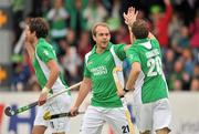 10 March 2012; Timothy Cockram, Ireland, celebrates with team-mate Michael Darling, after scoring his side's second goal. Men’s 2012 Olympic Qualifying Tournament, Ireland v Russia, National Hockey Stadium, UCD, Belfield, Dublin. Picture credit: Barry Cregg / SPORTSFILE