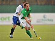 10 March 2012; Andrew McConnell, Ireland, in action against Evgeny Mokrousov, Russia. Men’s 2012 Olympic Qualifying Tournament, Ireland v Russia, National Hockey Stadium, UCD, Belfield, Dublin. Picture credit: Barry Cregg / SPORTSFILE