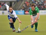 10 March 2012; John Jackson, Ireland, in action against Evgeny Mokrousov, Russia. Men’s 2012 Olympic Qualifying Tournament, Ireland v Russia, National Hockey Stadium, UCD, Belfield, Dublin. Picture credit: Barry Cregg / SPORTSFILE