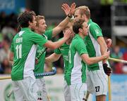 10 March 2012; Conor Harte, right, Ireland, celebrates with team-mates, from left, John Jermyn, Michael Watt, Eugene Magee and Michael Darling after scoring his side's fifth goal. Men’s 2012 Olympic Qualifying Tournament, Ireland v Russia, National Hockey Stadium, UCD, Belfield, Dublin. Picture credit: Barry Cregg / SPORTSFILE