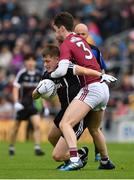 9 July 2017; Karl McKenna of Sligo is tackled by Sean Mulkerrin of Galway during the Electric Ireland Connacht GAA Football Minor Championship Final between Galway and  Sligo at Pearse Stadium in Galway. Photo by Ramsey Cardy/Sportsfile