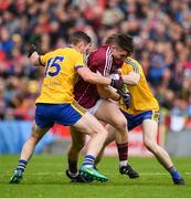 9 July 2017; Johnny Heaney of Galway is tackled by Ciaran Murtagh, left, and Cian Connolly of Roscommon during the Connacht GAA Football Senior Championship Final match between Galway and Roscommon at Pearse Stadium in Galway. Photo by Ramsey Cardy/Sportsfile