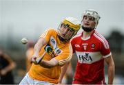 9 July 2017; Michael McGreevy of Antrim in action against Eoghan O'Kane of Derry during the Electric Ireland Ulster GAA Hurling Minor Championship Final match between Antrim and Derry at Owenbeg in Co Derry. Photo by Oliver McVeigh/Sportsfile