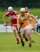 9 July 2017; Michael McGreevy of Antrim in action against Eoghan O'Kane of Derry during the Electric Ireland Ulster GAA Hurling Minor Championship Final match between Antrim and Derry at Owenbeg in Co Derry. Photo by Oliver McVeigh/Sportsfile