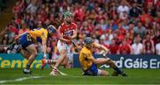 9 July 2017; Alan Cadogan of Cork beats Clare defenders David McInerney, 3, and Seadna Morey to score a goal in the 12th minute during the Munster GAA Hurling Senior Championship Final match between Clare and Cork at Semple Stadium in Thurles, Co Tipperary. Photo by Ray McManus/Sportsfile