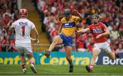 9 July 2017; Cathal Malone of Clare has a shot on goal against Cork goalkeeper Anthony Nash and Mark Coleman during the Munster GAA Hurling Senior Championship Final match between Clare and Cork at Semple Stadium in Thurles, Co Tipperary. Photo by Brendan Moran/Sportsfile