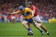 9 July 2017; Podge Collins of Clare is tackled by Christopher Joyce of Cork during the Munster GAA Hurling Senior Championship Final match between Clare and Cork at Semple Stadium in Thurles, Co Tipperary. Photo by Brendan Moran/Sportsfile