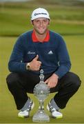9 July 2017; Jon Rahm of Spain with theDubai Duty Free Irish Open trophy on the 18th green on Day 4 of the Dubai Duty Free Irish Open Golf Championship at Portstewart Golf Club in Portstewart, Co Derry. Photo by Oliver McVeigh/Sportsfile