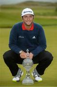 9 July 2017; Jon Rahm of Spain with theDubai Duty Free Irish Open trophy on the 18th green on Day 4 of the Dubai Duty Free Irish Open Golf Championship at Portstewart Golf Club in Portstewart, Co Derry. Photo by Oliver McVeigh/Sportsfile