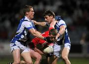 10 March 2012; Fintan Goold, Cork, in action against Darren Strong, left, and Colm Begley, Laois. Allianz Football League, Division 1, Round 4, Laois v Cork, O'Moore Park, Portlaoise, Co. Laois. Picture credit: Ray McManus / SPORTSFILE