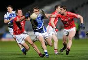 10 March 2012; Darren Strong, Laois, in action against Patrick Kelly, left, and Fintan Goold, Cork. Allianz Football League, Division 1, Round 4, Laois v Cork, O'Moore Park, Portlaoise, Co. Laois. Picture credit: Ray McManus / SPORTSFILE