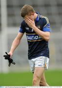 11 March 2012; Tipperary's Brian Jones leaves the field after being sent off by referee Michael Meade. Allianz Football League Division 4, Round 4, Tipperary v Cavan, Semple Stadium, Thurles, Co. Tipperary. Picture credit: Brian Lawless / SPORTSFILE