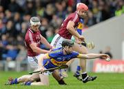 11 March 2012; Donagh Maher, Tipperary, in action against Bernard Burke, left, and Iarlaith Tannian, Galway. Allianz Hurling League Division 1A, Round 2, Tipperary v Galway, Semple Stadium, Thurles, Co. Tipperary. Picture credit: Brian Lawless / SPORTSFILE