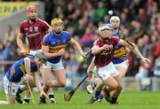 11 March 2012; Bernard Burke and Iarlaith Tannian, left, Galway, in action against, from left, Donagh Maher, Padraic Maher, and John O'Keeffe, Tipperary. Allianz Hurling League Division 1A, Round 2, Tipperary v Galway, Semple Stadium, Thurles, Co. Tipperary. Picture credit: Brian Lawless / SPORTSFILE