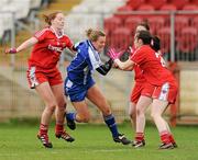 11 March 2012; Ellen McCarron, Monaghan, in action against Shannon Quinn, left, Lynda Donnelly and Maria Donnelly, right, Tyrone. Bord Gais Energy Ladies National Football League Division 1, Round 5, Tyrone v Monaghan, Healy Park, Omagh, Co. Tyrone. Picture credit: Oliver McVeigh / SPORTSFILE