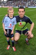 11 March 2012; Dublin captain Ger Brennan poses with eight year old Jack Murphy, from Swords, before the start of the game. Jack was a special guest of the Dublin County Board at the game. Allianz Football League Division 1, Round 4, Dublin v Armagh, Croke Park, Dublin. Picture credit: Ray McManus / SPORTSFILE