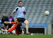 11 March 2012; Diarmuid Connolly shoots past the Armagh goalkeeper, Philip McEvoy, to score the fourth Dublin goal. Allianz Football League Division 1, Round 4, Dublin v Armagh, Croke Park, Dublin. Picture credit: Ray McManus / SPORTSFILE