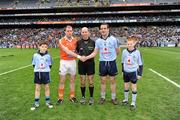 11 March 2012; Dublin mascotts John Foley, left, and Fiachra Potts, both members of the Na Fianna club, join referee Michael Collins and the two captains, Ger Brennan, Dublin, and Kieran McKeever, Armagh, before the start of the game. Allianz Football League Division 1, Round 4, Dublin v Armagh, Croke Park, Dublin. Picture credit: Ray McManus / SPORTSFILE