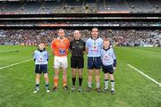 11 March 2012; Mascots, John Foley, left, and Fiachra Potts, both members of the Na Fianna club, join referee Michael Collins and the two captains, Ger Brennan, Dublin, and Kieran McKeever, Armagh, before the start of the game. Allianz Football League Division 1, Round 4, Dublin v Armagh, Croke Park, Dublin. Picture credit: Ray McManus / SPORTSFILE