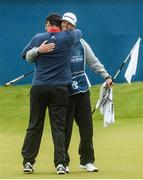 9 July 2017; Jon Rahm of Spain reacts with his caddie Adam Hayes after winning the Dubai Duty Free Irish Open on the 18th green on Day 4 of the Dubai Duty Free Irish Open Golf Championship at Portstewart Golf Club in Portstewart, Co Derry. Photo by Oliver McVeigh/Sportsfile