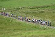 12 July 2017; A general view of the peloton on the ascent of the category one climb of Castle Hill during Stage 2 of the Scott Junior Tour 2017 at Doonagore, Co. Clare. Photo by Stephen McMahon/Sportsfile