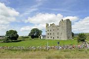 12 July 2017; A general view of the peloton as the race passes Leamaneh Castle during Stage 2 of the Scott Junior Tour 2017 at Doonagore, Co. Clare. Photo by Stephen McMahon/Sportsfile